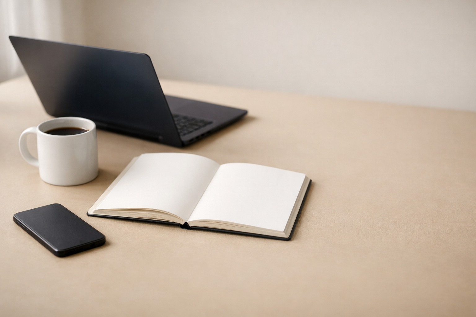 Minimal modern desk setup representing a content strategy for service businesses and professional firms