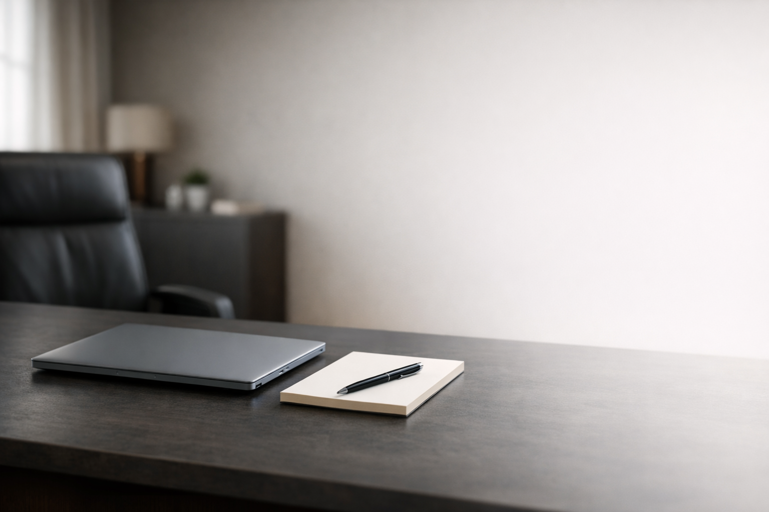 Minimal modern office desk with laptop and notebook representing a professional social media content strategy